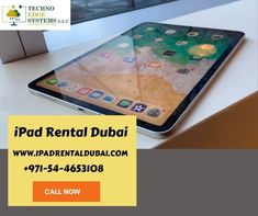 an ipad sitting on top of a table next to a window with the words ipad rental dubai