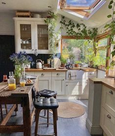 a kitchen filled with lots of counter top space next to a dining room table and chairs