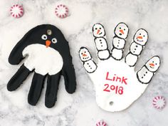 a hand painted to look like a penguin with the word link 2018 written on it