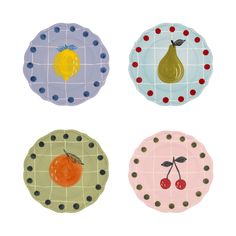 four plates with different designs and fruit on them