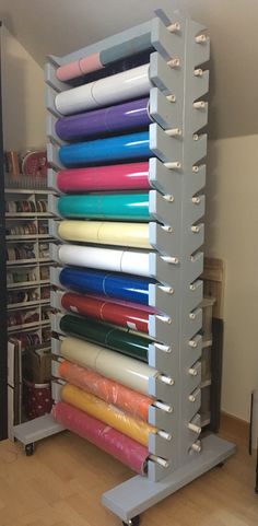 a rack with many different colored papers on it