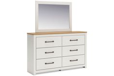 a white dresser with a mirror and drawers