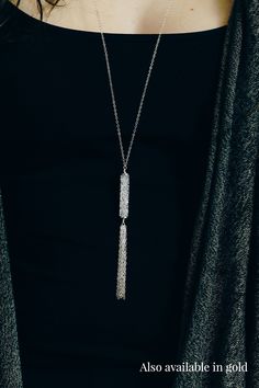 Bold and a little bit edgy, our long gold Swarovski tassel necklace will be your new favorite piece of jewelry. Perfect for a night out on the town or just to dress up a casual outfit, this necklace will add sparkle and sophistication to your wardrobe. Complete the look with the matching earrings which you can find here. Details The necklace is 32" long. The Swarovski tube bead is 30mm long. The pendant drop is about 3.25" long. Because of the length of the necklace, there is no clasp. Materials Chic Dangle Lariat Necklace For Party, Chic Lariat Dangle Necklace For Parties, Silver Jewelry With Adjustable Chain For Night Out, Chic Party Lariat Necklace With Dangle, Metal Dangle Long Necklace For Party, Metal Long Dangle Necklace For Party, Silver Metal Necklaces For Night Out, Long Tassel Necklace For Party, Silver Metal Necklace For Night Out