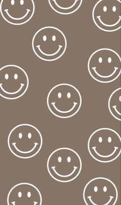 a brown background with white smiley faces on it