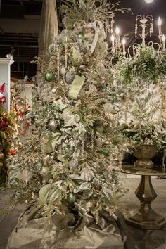 a white christmas tree with ornaments and lights