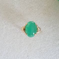 Chrysoprase Cabochon ring, Chrysoprase ring, Chrysoprase and gold ring, Cabochon Chrysoprase in 10 carat yellow gold. Chrysoprase weighs 5 carats Chrysoprase measures 14x10mms The ring is in 10 carat yellow gold Ring size is M 1/5 (Australian size) or 6 1/4 (US size). Ring is ready to ship in 1-2 working days.  We resize free of charge.  Please allow a couple of additional days for resizing. All my rings come in a velvet ring box.  I am highly conscious of environmental damage that extra packagi Classic Green Oval Opal Ring, Heirloom Green Emerald Oval Cabochon Ring, Heirloom Green Oval Cabochon Emerald Ring, Classic Green Cabochon Emerald Ring, Green Opal Oval Ring In 14k Gold, Green Emerald Oval Cabochon Ring, Green Emerald Ring With Oval Cabochon, Classic Green Cabochon Ring, Heirloom Green Oval Cabochon Rings