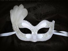 White Embroidery Masquerade Mask With Feathers White Lace Elegant White Masquerade Mask For Carnival, Elegant White Masquerade Mask For Mardi Gras, White Eye Mask For Costume Party, White Eye Mask For Masquerade, White Mardi Gras Masquerade Masks, Elegant White Eye Mask, White Masquerade Masks And Prosthetics For Mardi Gras, White Carnival Eye Mask, White Masks For Carnival Costume Party