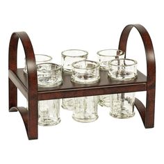 a wooden shelf with glasses on it and an iron holder for the glass cups in front