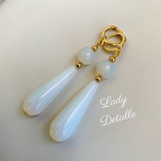 "WHITE OPAL stone Teardrop Earrings by Lady Detalle 16k gold historic Reproduction Victorian Earrings, real White OPAL stone long teardrop jewelry These real White OPAL stone Teardrop earrings are inspired by the many extant examples of the Victorian, Regency and Georgian eras! GORGEOUS naturally inclusive gorgeous semi translucent opal stones: each pair of earrings finished with 16k gold plated or silver plated LOOPS, and closely matched to coordinate well together. These have a gorgeous GLOW a Handmade White Long Drop Teardrop Earrings, White Long Drop Teardrop Earrings, White Spiritual Teardrop Earrings, Handmade Elegant Long Drop Teardrop Earrings, Formal White Teardrop Pendant Earrings, White Teardrop Pendant Earrings For Formal Occasions, Classic White Teardrop Pendant Earrings, Elegant White Earrings With Natural Stones, White Teardrop Pendant Jewelry With Matching Earrings