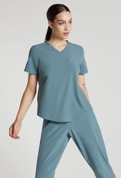 Emily is size 2. She is wearing XS. Slim Suit Pants, Mens Workout Pants, Wrap Tunic, Green Scrubs, Womens Golf Shirts, Women's Uniforms, Cropped Linen Pants, Activewear Sets, Round Neck Tees