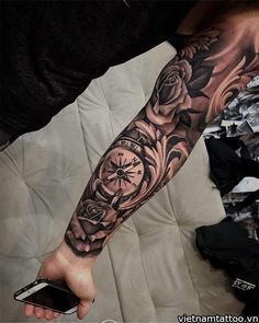 a person with a clock tattoo on their arm