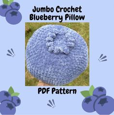 a crocheted blueberry pillow is shown with the text, jumbo crochet blueberry pillow