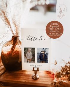 a card with two photos on it sitting next to a vase filled with dried flowers