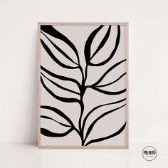 a black and white leaf print on a wall