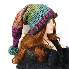 "Make winter fun with this thick and warm witchy stocking hat. I've crocheted this with a chunky yarn and a brown Sherpa brim that can be pulled down over your ears. 21\" long from the tip to the brim, this hat has enough body that it can be worn with the tip hanging down or tucked into a more upright shape, and the end has a matching pom pom. Certain to add fun character to your winter outdoor wear or gift to a friend who needs that extra warmth. Works for him or her! Lots of stretch, so one si Adjustable Fun Crochet Hat For Winter, Whimsical Adjustable Crochet Winter Hat, Whimsical Crochet Cap For Winter, Whimsical Winter Crochet Cap, Whimsical Winter Beanie Costume Hat, Whimsical Beanie Costume Hats For Winter, Handmade Yarn Costume Hats And Headpieces For Winter, Whimsical Crochet Beanie Hat For Winter, Whimsical Crochet Beanie For Winter