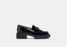 Coach Lug Sole Loafer, Classic Low-top Loafers With Lug Sole, Luxury Slip-on Platform Loafers With Lug Sole, Black Leather Luxury Platform Loafers, Black Low-top Platform Loafers With Lug Sole, Signature Hardware, 90s Inspired, Lug Sole, Loafer Flats