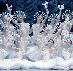 a group of ballerinas in white tutu skirts are surrounded by bubbles and snowflakes