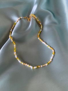 Handmade yellow beaded necklace! The whole length of the necklace (including extension) is approximately 45cm. If you have any questions, please message me! Yellow Necklace Bead, Yellow Bead Necklace, Yellow Round Bead Necklaces For Summer, Yellow Necklaces With Colorful Beads For Summer, Yellow Round Beads Necklace For Summer, Yellow Beaded Necklaces With Letter Beads For Summer, Yellow Beaded Necklaces With Round Beads For Summer, Yellow Beaded Necklaces For Summer, Yellow Beaded Chain Necklaces For Summer