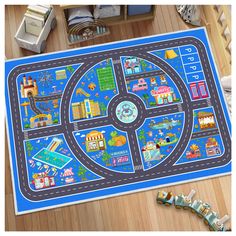 a children's play mat with cars and buildings on it