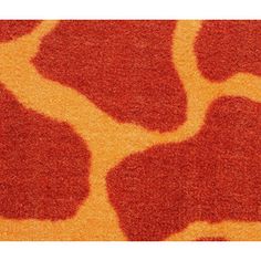 an animal print rug with red spots on it