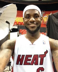 a basketball player is posing for a photo