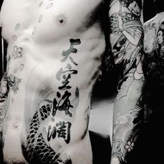 a man with many tattoos on his body