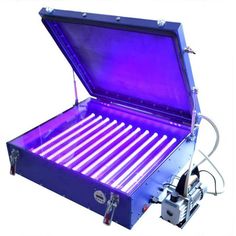 an open purple box with several tubes in it that are lit up and on the inside