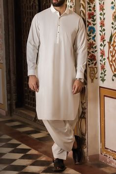 It is a Pakistani men's designer clothes on sale available in our online store. The colour of this men's shalwar kameez is off white. This two piece men's dress is made from the blended fabric. The traditional men's designer clothes on sale is available in custom size too. ADDITIONAL INFORMATION SKU: M2748 Colour: Off white Fabric: Blended Design: Shalwar kameez Event: Festival, Casual For More Details Call / Whatsapp Us Now: +1-732-910-5427 Why NameerabyFarooq: 100% Accurate Measurement & F Pakistani Mens Shalwar Kameez, Pakistani Kurta Designs, Shalwar Kameez Pakistani, Pakistani Men, Man Dress Design, Ladies Design, Arabic Clothing, Pakistani Kurta, Casual Attire For Women