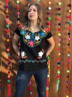 Beautiful Embroidered Floral Blouse From Chiapas. This blouse is hand embroidered and made with love by Mexican Artisans. It is the perfect pop of color to add style to your wardrobe. Note: You have the option to purchase the blouse with the belt modeled for a special price or purchase the blouse without the belt, Festival Short Sleeve Top With Embroidered Neckline, Festival Embroidered Neckline Top With Short Sleeves, Festival Embroidered Top With Short Sleeves, Embroidered Short Sleeve Blouse For Festivals, Cotton Tops With Multicolor Embroidered Neckline, Festival Blouse With Embroidered Neckline And Short Sleeves, Folk Style Festive Tops With Embroidered Border, Traditional Tops With Multicolor Resham Embroidery, Traditional Short Sleeve Tops With Floral Embroidery