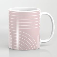 a pink coffee mug with white lines on it