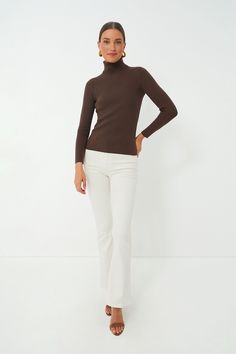 The Arlo Turtleneck Sweater is a classic layering piece that you’ll be wearing all season long, year after year. In a super comfy, stretch ribbed fabric, this fitted silhouette can be worn under a cardigan or tucked into your favorite denim. Style this versatile number under a blazer for a chic office outfit to give you a confidence boost before your next meeting or with mini skirts for effortless seasonal transitions. Fold back turtleneck Long sleeves Fitted Ribbed fabric Material: 43% Rayon, 2 Chic Office Outfit, Office Outfit, Plus And Minus, Chic Office, Ribbed Turtleneck, Denim Style, Confidence Boost, Fitted Silhouette, Office Outfits