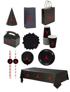 an assortment of black and red party supplies including paper bags, napkins, cups, plates