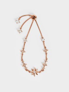 Add a bit of sparkle to your everyday outfit with this fine bracelet. Featuring a crystal-embellished star centrepiece and sparkle charms along the delicate wrist chain, this pretty piece is especially stunning when it catches the light. The subtle shine of this dainty jewellery will complete a sophisticated evening look perfectly. Star Centerpieces, Fine Bracelet, Charles And Keith, Wrist Chain, Dainty Jewellery, Star Motif, Size Chart For Kids, Charles Keith, Everyday Outfit