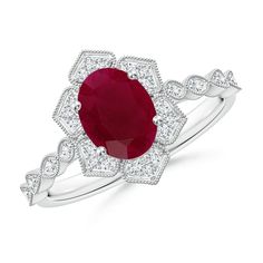 Inspired by the charm of a bygone era, this oval ruby ring is an absolute stunner. The fiery gem is prong-set amid a scintillating diamond halo that highlights its beautiful hue. Diamond-studded trillium flower motifs on the shank and milgrain detailing on the edges augment the overall beauty of this 14k white gold ring. Classic Oval Lab-created Ruby Diamond Ring, Oval Lab-created Ruby Birthstone Ring, Heirloom Style Oval Lab-created Ruby Ring, Heirloom Red Oval Diamond Ring, Heirloom Oval Lab-created Ruby Ring, Red Oval Diamond Ring, Vintage Oval Ruby Ring With Lab-created Ruby, Vintage Oval Lab-created Ruby Ring, Trillium Flower