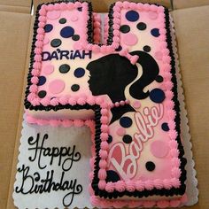 two square birthday cakes decorated with pink and black icing