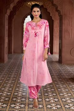 Cherry blossom pink kurta with prints, tassels, coin and sequin work. Comes with matching printed pant. - Aza Fashions Unstitched Pink Sets With Printed Motifs, Unstitched Pink Sets For Eid, Elegant Pink Palazzo Set With Printed Motifs, Pink Floral Print Palazzo Set For Eid, Festive Pink Floral Print Palazzo Set, Elegant Pink Sets With Printed Motifs, Pink Long Sleeve Sets For Diwali, Pink Long Sleeve Pant Set For Spring, Pink Floral Print Unstitched Salwar Kameez