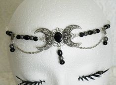 "This beautiful circlet has black Czech glass beads, black pearl beads, sterling silver plated filigree beads, sterling silver plated accents, sterling silver plated chain and sterling silver plated crescent moon pendant with black onyx setting. An elegant headpiece. 20\" long can be adjusted to 24\". Lobster clasp." Adjustable Silver Beaded Headpiece, Bohemian Black Metal Body Jewelry, Silver Beaded Festival Headpiece, Silver Beaded Headpiece For Festival, Handmade Black Bohemian Body Jewelry, Gothic Metal Jewelry With Black Beads, Gothic Black Beaded Metal Jewelry, Adjustable Silver Crown Headpiece, Gothic Adjustable Headpieces For Weddings