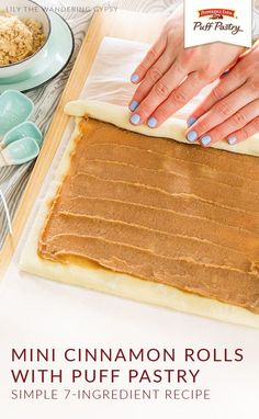 a person making cinnamon rolls with puff pastry