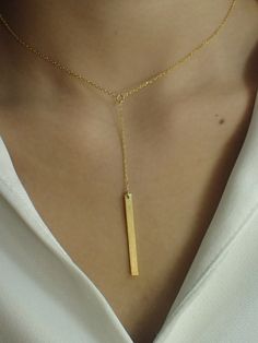 Dainty Bar Necklace / Skinny Vertical Bar / Silver Gold plated Necklace / Simple Everyday Necklace / Bridesmaids Gift About Features- * Made to order * Materials: 925 Sterling Silver * Gold color: Yellow Gold Plating, White Gold Plating, and Rose Gold Plating * Bar dimensions: 36mm long x 3mm wide * Layaway Plan Available * SKU: N173 For Ready-to-ship items search here, https://etsy.me/39BDvMS As a reference, I've included the widths of coins for your visual reference: Dime = 1.25mm Penny = 1.4m Minimalist Yellow Gold Necklace For Party, Gold Jewelry With Adjustable Length As Gift, Gift Adjustable Length Gold Jewelry, Minimalist Gold Plated Necklace For Party, Minimalist Gold-plated Necklace For Party, Minimalist Pendant Jewelry For Party, Minimalist Dangle Necklaces For Parties, Minimalist Gold Bar Necklace As Gift, Gold Plated Dangle Lariat Necklace Gift