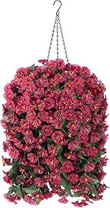 a bunch of pink flowers hanging from a chain