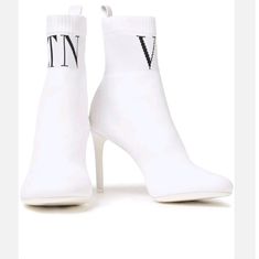 Valentino Garavani Body Tech Knit Sock Bootie Vltn 90 In White. These Stunning Ankle Boots Are Constructed Of White Stretch Knit With White Rubber Soles. They Feature A Sock-Like Design With A Black "Vltn" Lettering And A Slender Stiletto Heel. These Are Boots Are Perfect For Any Everyday Look, From Valentino! New In Box Upper Material:Textile / Leather Lining Material:Textile / Leather Outsole Material:Leather / Rubber Shoe Shaft Style:Ankle Size :Eu 39.5 / Us 9.5 / Uk 6.5 Heel: 4" Shaft: 6.5" Luxury White Boots For Fall, Designer Fitted White Boots, Luxury White Winter Boots, Designer White Boots For Spring, Body Tech, Sock Bootie, Rubber Shoe, Valentino Garavani Shoes, Sock Boots