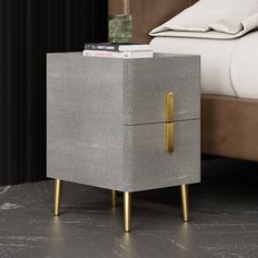 a bedside table with a magazine holder on it and a bed in the back ground