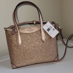 This Bag Is A Stunner!! Brand New With Tags. Last Years Style, So May Be Hard To Find. Rose Gold Glitter Fabric Satchel. Comes With Shoulder Strap. Elegant Kate Spade Glitter Bags, Elegant Glitter Shoulder Bag, Luxury Glitter Bags For Everyday Use, Chic Sparkling Gold Bag, Luxury Glitter Rectangular Bag, Chic Sparkling Gold Bags, Chic Gold Sparkling Bag, Chic Kate Spade Party Bags, Luxury Gold Sequin Bag