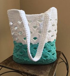 a crocheted bag sitting on top of a table