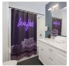 a bathroom with a purple shower curtain that says boogie on the side and a white toilet next to it