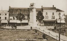 an old black and white photo of a building with a clock tower