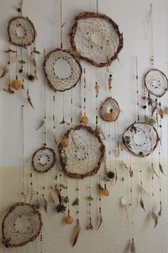 there are many dream catchers hanging on the wall