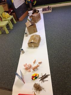 several toys are laying on a long white table