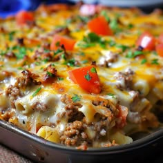 a casserole dish with meat, cheese and vegetables