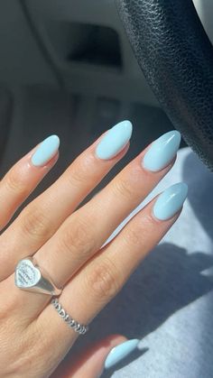 BABY BLUE NAILS Sky Blue Aesthetic Nails, Gel X Solid Color, Short Almond Baby Blue Nails, Almond Nails Sky Blue, Light Blue Minimalist Nails, Baby Blue Almond Nails Designs, Baby Blue Nails With Snowflakes, Blue Acrylic Nails Almond Shape, Light Bright Blue Nails